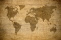 Grunge map of the world over wooden background