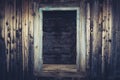 Empty window opening of the old abandoned house. Blue toned image. Royalty Free Stock Photo