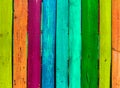 Grunge wooden colored background - paint a rainbow on old fence