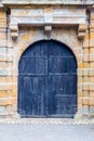 Grunge wooden door, ancient european tourist city Royalty Free Stock Photo