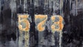 Grunge worn rusty metal background with chipped and faded painted numbers