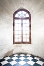 Grungy arched window inside old building. Royalty Free Stock Photo