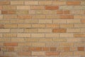 Grungy beige and orange vintage brick wall texture background