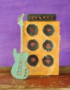 Grungy cardboard model of a guitar and an amp stack,music, live performance,grunge rock concept