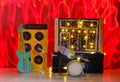 Grungy cardboard models of synthesizer,drum kit,guitar,amplifier and microphone on stage with wild light trails,music,performance, Royalty Free Stock Photo