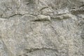 Grungy cracked stone texture from natural rock retro style. Weathered ancient wall background Royalty Free Stock Photo