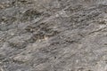 Grungy cracked stone texture from natural rock retro style. Weathered ancient wall background Royalty Free Stock Photo