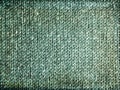 Grungy faded green knitted background