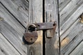 Grungy grey color wooden door with lock Royalty Free Stock Photo