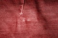 Grungy jeans cloth pattern in red tone. Royalty Free Stock Photo