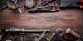 Grungy old tools on a wooden background