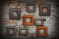 Grungy old wall full of wooden frames Royalty Free Stock Photo