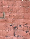 Grungy red brick wall close up with paint splashes