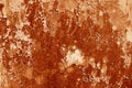 Grungy rusted metal wall surface in orange tone Royalty Free Stock Photo