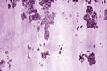 Grungy rusted metal wall surface in purple tone