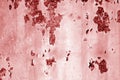 Grungy rusted metal wall surface in red tone