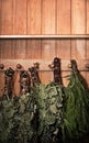 Grungy Sauna Accessories. Gloomy Birch Brooms. Background Photo for Design or Banner. Wooden Bathhouse Backdrop