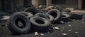 A grungy setting featuring burnt out car tire remnants on an ashen backdrop Royalty Free Stock Photo