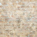 Grungy shabby vintage brick wall with floral pattern Royalty Free Stock Photo