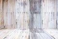 Grungy textured red brick and stone wall with warm brown wooden floor inside old neglected and deserted interior, masonry and carp Royalty Free Stock Photo