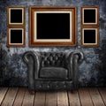 Grungy wall with Classic Brown leather armchair and old wood Royalty Free Stock Photo