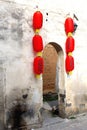 Grungy wall with red Chinese lanterns in Hongcun, China Royalty Free Stock Photo