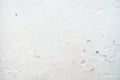 Grungy white concrete wall background. Background from high detailed fragment stone wall. Cement texture Royalty Free Stock Photo