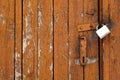 Grungy wooden door with lock Royalty Free Stock Photo
