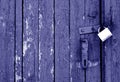 Grungy wooden door with lock in blue tone Royalty Free Stock Photo