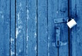 Grungy wooden door with lock in navy blue tone Royalty Free Stock Photo