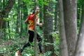 GRUNIVKA, SUMY REGION, UKRAINE - JUNE 21, 2021: Sportsman running through the forest on the race of SKIF Cup XIV sports