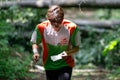 GRUNIVKA, SUMY REGION, UKRAINE - JUNE 21, 2021: Sportsman running through the forest on the race of SKIF Cup XIV sports