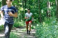 GRUNIVKA, SUMY REGION, UKRAINE - JUNE 21, 2021: Sportsman running through the forest on the race of SKIF Cup XIV sports