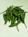 Grup of green chilli over white background