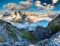 Gruppo Del Cristallo mountain range at foggy summer morning. Dolomites mountains, Italy, Europe.