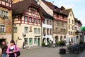 Gruyere, Switzerland - May, 2017: The street of old town touristic place, with painted with fresco ancient houses half-timbere
