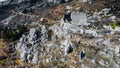 Ruins of old medieval village of Greolieres, drone aerial view of church, Alpes Maritimes, France