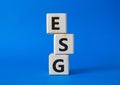 GSG - Environmental, Social and Governance symbol. Concept word GSG on wooden cubes. Beautiful blue background. Business and GSG