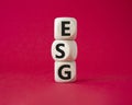 GSG - Environmental, Social and Governance symbol. Concept word GSG on wooden cubes. Beautiful red background. Business and GSG