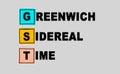 GST - abbreviation on gray background. Business concept. Multi colored square sticky notes on gray background, top view. Greenwich