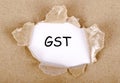 GST word written on torn paper Royalty Free Stock Photo