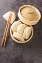 Gua bao, steamed buns in bamboo closeup, bao buns. Vertical top view Royalty Free Stock Photo