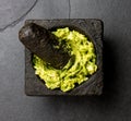 Guacamole avocado sauce in stone mortar. Top view Royalty Free Stock Photo