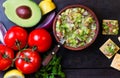 Guacamole latin american mexican sauce in clay bowl and ingredients Royalty Free Stock Photo