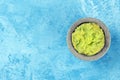 Guacamole in a molcajete, Mexican avocado dip in the traditional stone mortar Royalty Free Stock Photo