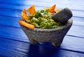 Guacamole with nachos in Mexican molcajete