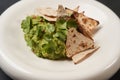 Guacamole with pita chips on white plate, close-up. Mexican guacamole Royalty Free Stock Photo