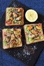 Guacamole toasts with mussels. Healthy toasts with avocado pasta and mussels.