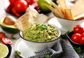 Guacamole is a traditional Mexican dip made of avocado, onion, tomatoes, coriander, chilli peppers, lime and salt with the additio Royalty Free Stock Photo