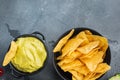 Guacamole traditional mexican spicy avocado dip, on gray background, top view or flat lay with copy space for text